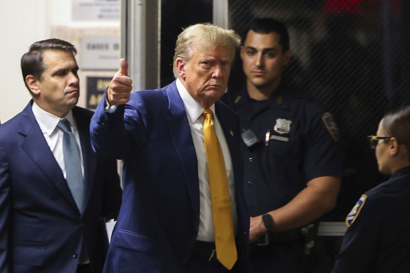 Former President Donald Trump returns to Manhattan criminal court after a break in his trial in New York, Thursday, May 2, 2024. (Charly Triballeau/Pool Photo via AP)