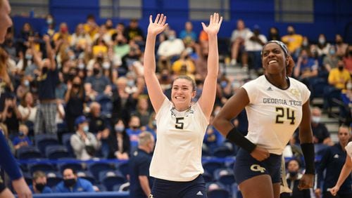 Georgia Tech outside hitters Biana Bertolino (arms raised) and Mikaila Dowd celebrate during Georgia Tech's 3-2 win over No. 2 Pittsburgh Oct. 10, 2021 in Pittsburgh's Fitgerald Field House. (Matt Hawley/University of Pittsburgh)