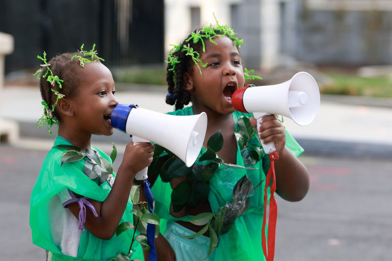 Aubrey Kidd, 7 and Kawan Ward, 5, chant with demonstrators outside of the attorney general’s office in Downtown Atlanta on Friday, September 8, 2023. On Tuesday, Georgia Attorney General Chris Carr announced that a total of 61 training center activists have been charged with violating the state’s Racketeer Influenced and Corrupt Organizations act. (Natrice Miller/ Natrice.miller@ajc.com)