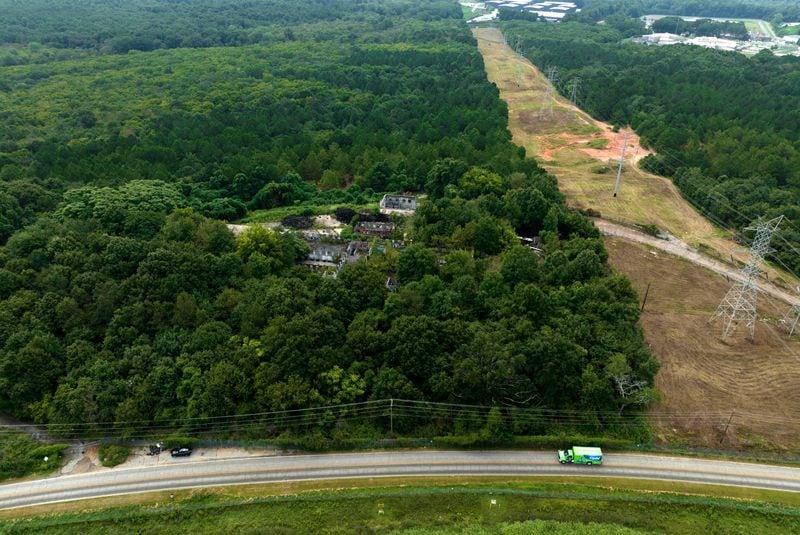 August 9, 2022 Atlanta - Aerial photograph shows the site of the proposed Atlanta public safety training center at the site of the old Atlanta prison farm in Atlanta on Tuesday, August 9 2022. Key Road shows in foreground. A growing number of southeast Atlanta neighborhoods are speaking out against the proposal to build a massive training center for police officers and firefighters on forested land in DeKalb County. (Hyosub Shin / Hyosub.Shin@ajc.com)