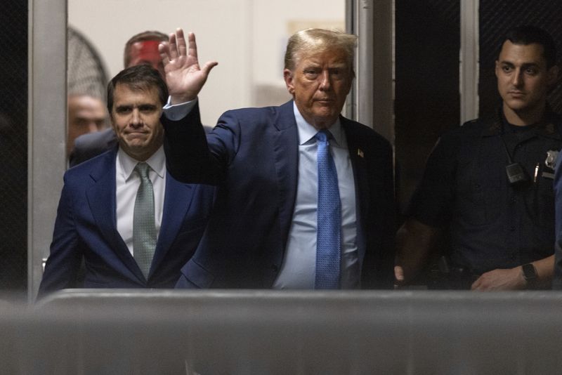 Former President Donald Trump returns from a break in his trial at Manhattan criminal court in New York, Friday, April 26, 2024. (Jeenah Moon/Pool Photo via AP)