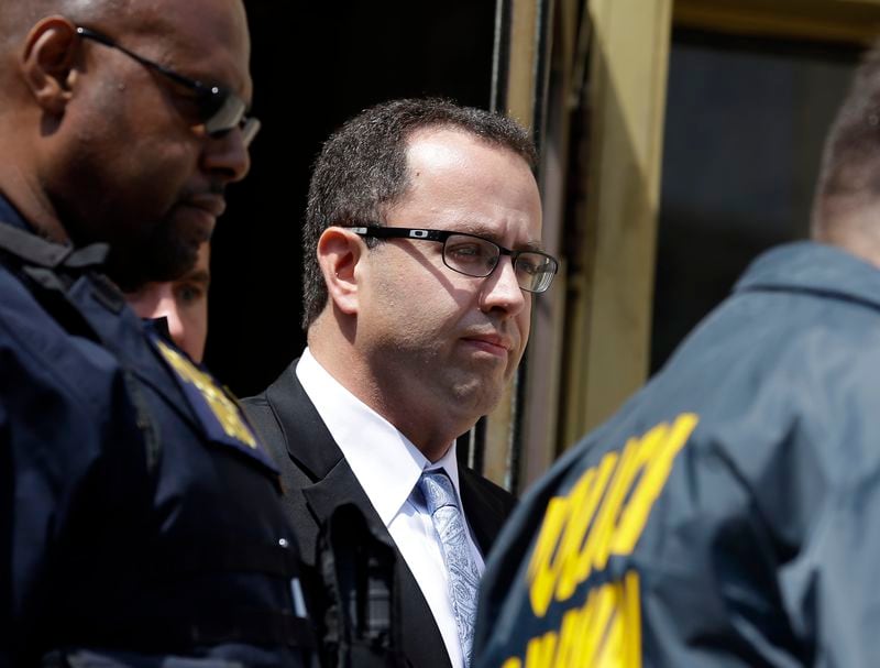 FILE - In this Aug. 19, 2015 file photo Former Subway restaurant spokesman Jared Fogle leaves the Federal Courthouse in Indianapolis following a hearing on child-pornography charges. Ten victims of Fogle, who agreed to plead guilty to child pornography and sex-with-minors charges, have received the $100,000 in restitution he was ordered to pay each of them, and the remaining four should receive theirs before he is sentenced in the coming weeks. (AP Photo/Michael Conroy, file)