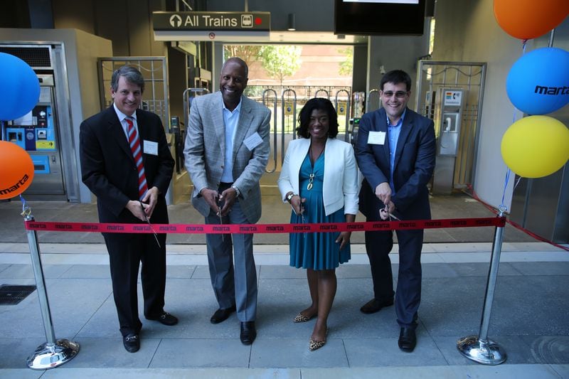A ribbon cutting for State Farm's pedestrian bridge to the Dunwoody MARTA station was held Thursday, Sept. 28, 2017. From left: Alex Chambers, regional vice president for developer KDC; Michael Holmes, operations vice president for State Farm; Rukiya Thomas, MARTA chief of staff; and Justin Tomczak, media relations manager for State Farm. Photo credit: State Farm