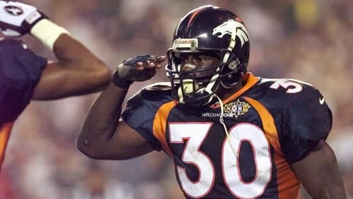 Broncos running back Terrell Davis salutes after his third quarter touchdown during Super Bowl XXXII.