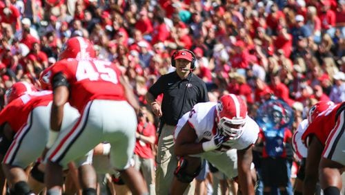 Kirby Smart looks at home in between the hedges.