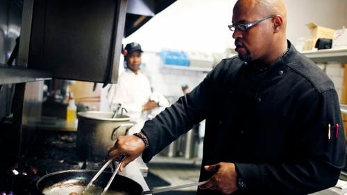 Chef Tony Morrow cooks some shrimp at The Pecan in 2010. / AJC file photo