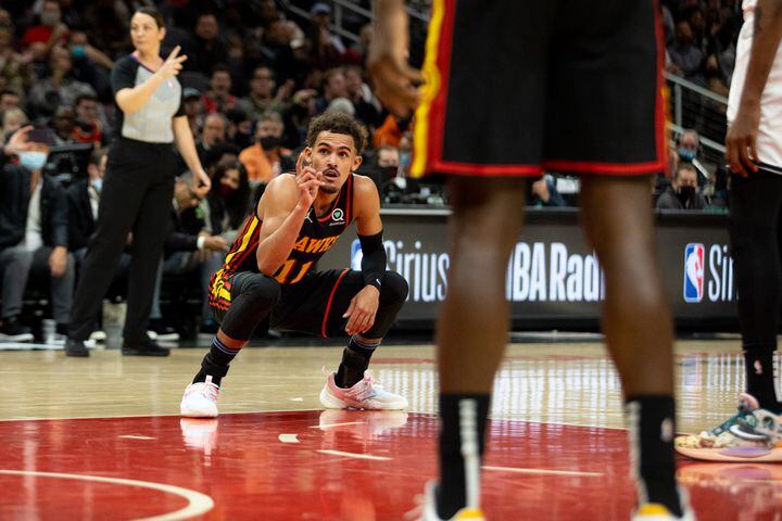 The Hawks' Trae Young (11) makes a hand motion during a game between the Atlanta Hawks and the Brooklyn Nets at State Farm Arena in Atlanta, GA., on Friday, December 10, 2021. (Photo/ Jenn Finch)