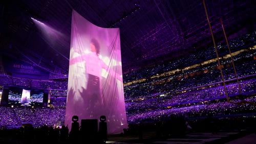 Justin Timberlake performs with an image of Prince during halftime at the NFL Super Bowl 52 football game between the Philadelphia Eagles and the New England Patriots, Sunday, Feb. 4, 2018, in Minneapolis. (AP Photo/Tony Gutierrez)