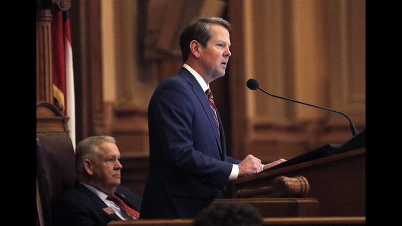 Georgia Gov. Brian Kemp, right, speaks to members of the Georgia House as House Speaker David Ralston looks on during the final 2019 legislative session at the State Capitol Tuesday, April 2, 2019, in Atlanta. (AP Photo/John Bazemore)