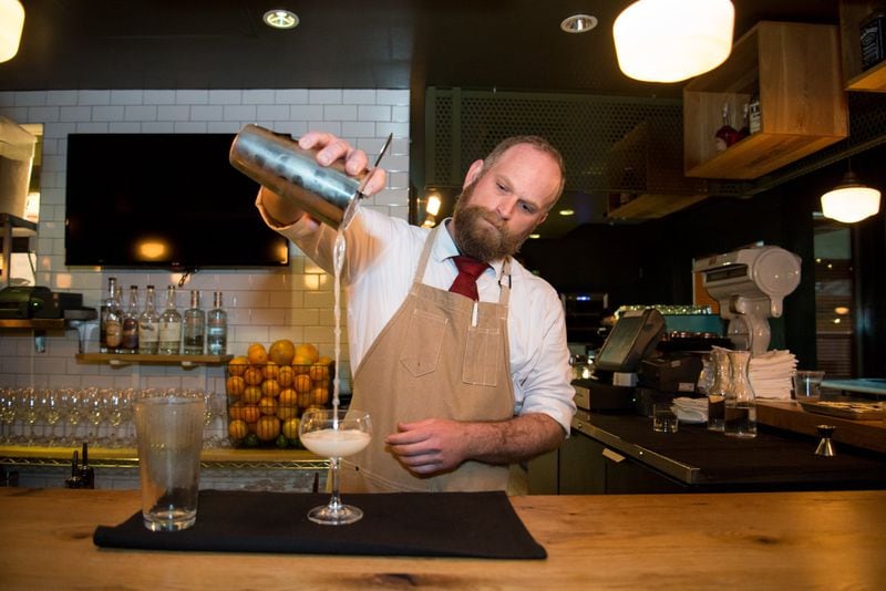 Bartender James Szanyi pours a Southern 75 cocktail, one of your options at the Federal. CONTRIBUTED BY MIA YAKEL