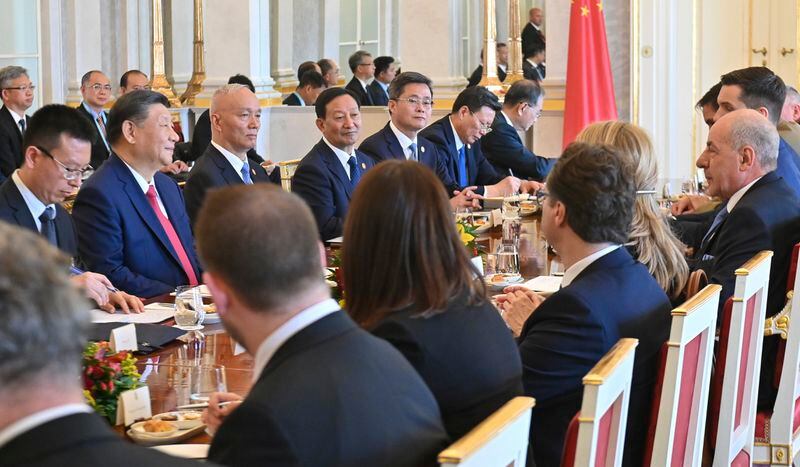 Hungarian President Tamas Sulyok, right, and Chinese President Xi Jinping, on table second left, during their meeting in the presidential Alexander Palace in Budapest, Thursday, May 9, 2024. (Noemi Bruzak /MTI via AP)