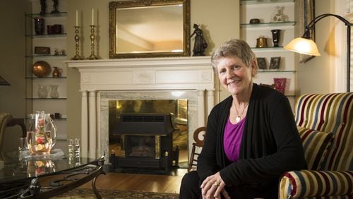 Lisa Griebel poses for a portrait in her new living room, redecorated with furniture from her late mother’s house by One Day Design, on June 20, 2017 in Minneapolis, Minn. (Renee Jones Schneider/Minneapolis Star Tribune/TNS)