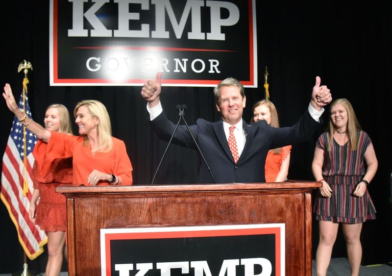 November 6, 2018 Athens - GOP gubernatorial candidate Brian Kemp gives thumbs up as he takes on stage with his family during his election watch party at The Classic Center in Athens on Tuesday, November 6, 2018. HYOSUB SHIN / HSHIN@AJC.COM