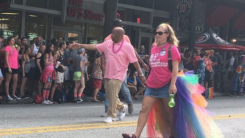 U.S. Rep. John Lewis greets the crowd at the Atlanta Pride parade. AJC/Greg Bluestein