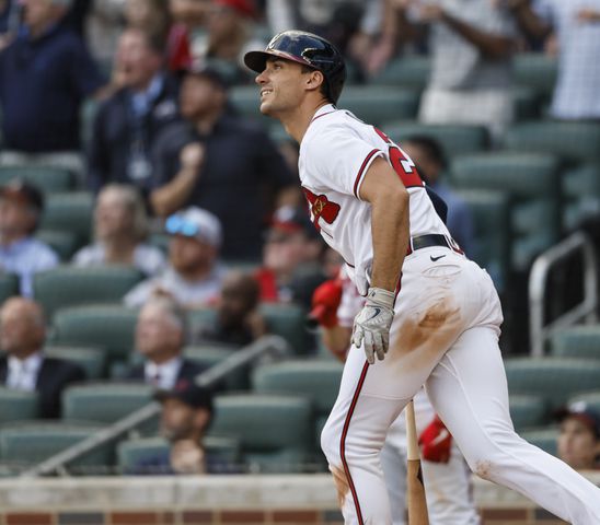 Atlanta Braves' Matt Olson hits a three-run homer during the ninth inning of game one of the baseball playoff series between the Braves and the Phillies at Truist Park in Atlanta on Tuesday, October 11, 2022. (Jason Getz / Jason.Getz@ajc.com)