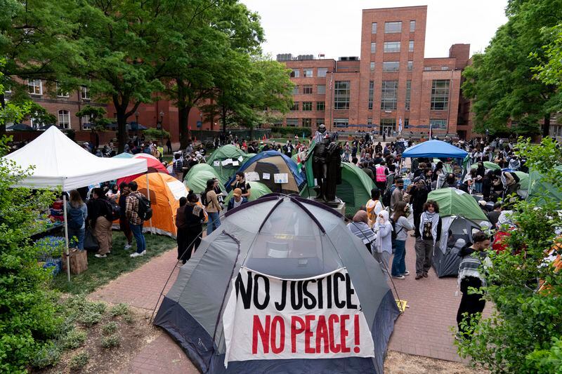 George Washington University students set tents in the campus during a pro-Palestinians protests over the Israel-Gaza War, Thursday, April 25, 2024, in Washington. (AP Photo/Jose Luis Magana)