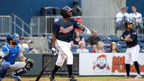 In this photo taken Wednesday, May 3, 2017, and provided by the Gwinnett Braves, Gwinnett Braves' Ryan Howard watches his two-run home run during the fourth inning of a minor league baseball game against the Durham Bulls in Gwinnett, Ga. Howard is an MVP, a World Series champion and once one of baseball's most feared sluggers. So what's he doing in the minor leagues at age 37? "I've still got something in the tank," he says. (Jim Lacey/Gwinnett Braves via AP)