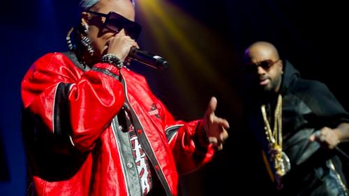 Da Brat (left) performs on stage at the Fox Theatre in Atlanta with Jermaine Dupri during the So So Def 20th Anniversary Concert on February 23, 2013.