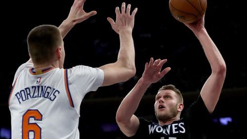 Cole Aldrich of the Minnesota Timberwolves heads for the net as Kristaps Porzingis of the New York Knicks defends at Madison Square Garden on December 2, 2016 in New York City.  (Photo by Elsa/Getty Images)