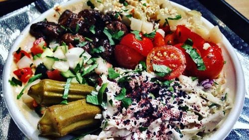 The salatim bowl at Yalla includes hummus, pickled vegetables, roasted mushrooms, chopped tomatoes and labne. The Canteen food hall that’s headed for the Spence’s former spot will include outposts of Yalla and Fred’s Meat & Bread. CONTRIBUTED BY WYATT WILLIAMS