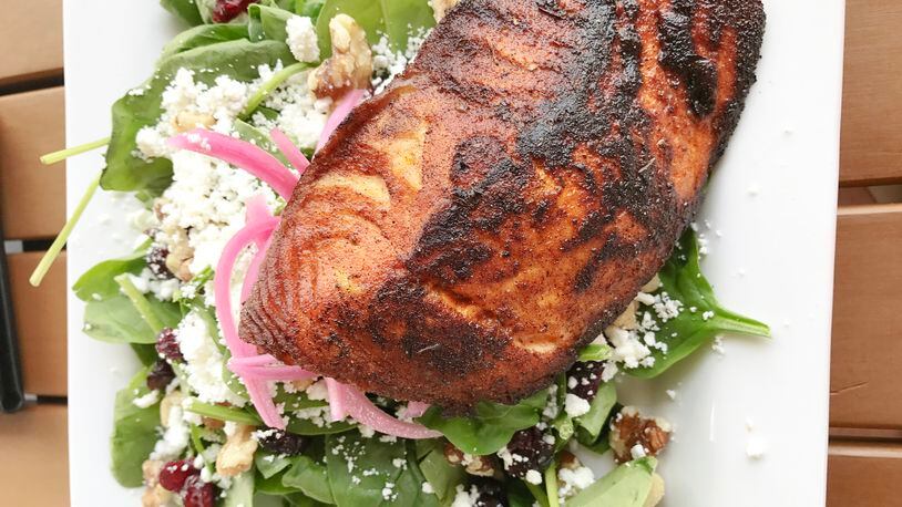 Grilled Faroe Island salmon over a spinach salad at Volare Bistro in Hapeville. / Photo by Ligaya Figueras
