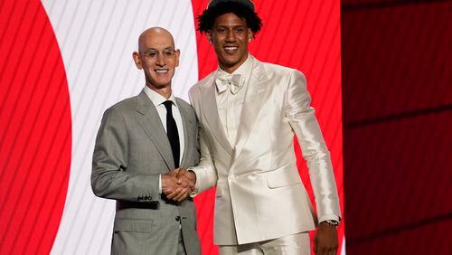 Jalen Johnson poses with NBA Commissioner Adam Silver after being selected 20th by the Atlanta Hawks during the 2021 NBA draft. Who will the Hawks select with their first pick Thursday night? (AP Photo/Corey Sipkin)