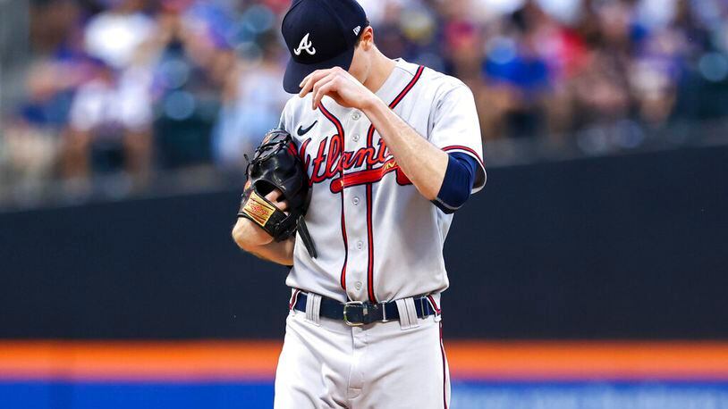 Braves starting pitcher Max Fried adjusts his cap while facing the Mets on Saturday in New York. (AP Photo/Jessie Alcheh)