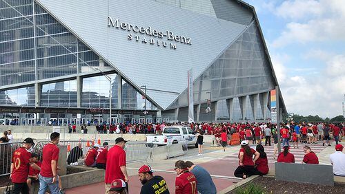 Fans lining up outside Mercedes-Benz Stadium to view Sunday’s World Cup final on the halo screen before this afternoon’s Atlanta United vs. Seattle Sounders FC match. (Photo: J. Scott Trubey / AJC)