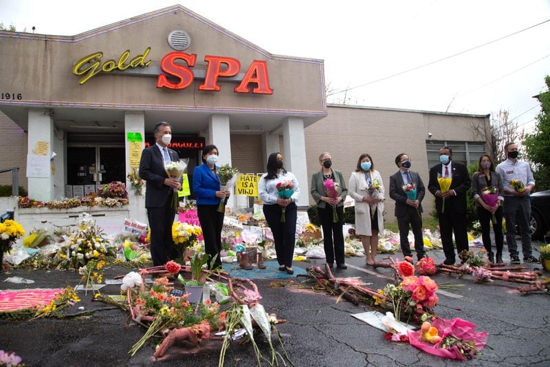Members of the Congressional Asian Pacific American Caucus and two metro Atlanta members of Congress stand holding flowers in front of the Gold Spa in Atlanta on Sunday, March 28, 2021. At this spa and another in Atlanta, Yong Ae Yue, 63; Soon Chung Park, 74; Suncha Kim, 69; and Hyun Jung Grant, 51, were shot and killed. (Photo: Steve Schaefer for The Atlanta Journal-Constitution)
