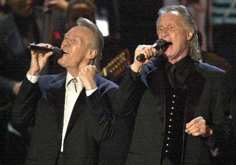 “Blue-eyed soul,” trailblazers, The Righteous Brothers, Bobby Hatfield, left, and Bill Medley perform before being inducted into the Rock and Roll Hall of Fame during the 18th Annual induction ceremony  in 2003, at New York's Waldorf Astoria. (AP Photo/Gregory Bull)