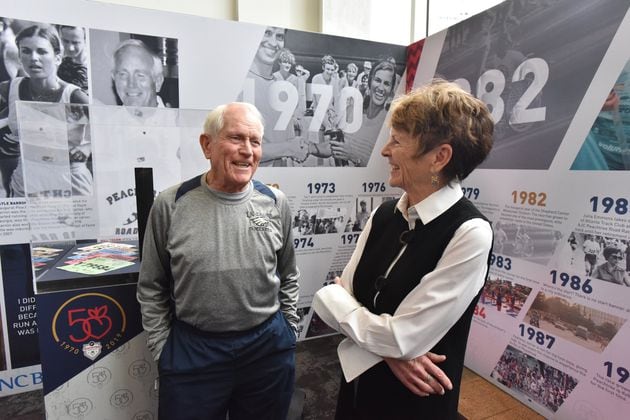 During the 50th anniversary of the Peachtree Road Race in 2019 Julia Emmons (right) celebrated with Bill Thorn. Thorn was the only individual who ran the race every one of those first 50 years. The two are seen at an unveiling of a traveling exhibit on the race. HYOSUB SHIN / HSHIN@AJC.COM