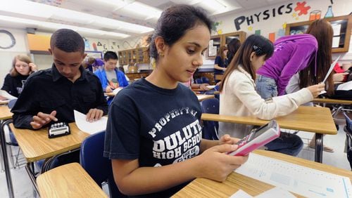 Many students, like these in an AP physics class, sit for final exams at the end of the courses that determine whether they earn college credits for their efforts. In the wake of the coronavirus, those tests are moving online.