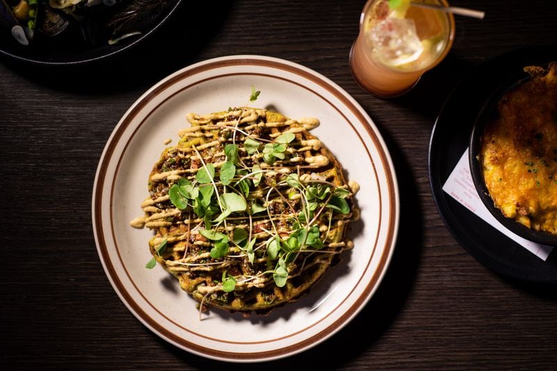 Wonderkid Falafel Waffle with tabbouleh, roasted eggplant and sunflower sprouts.