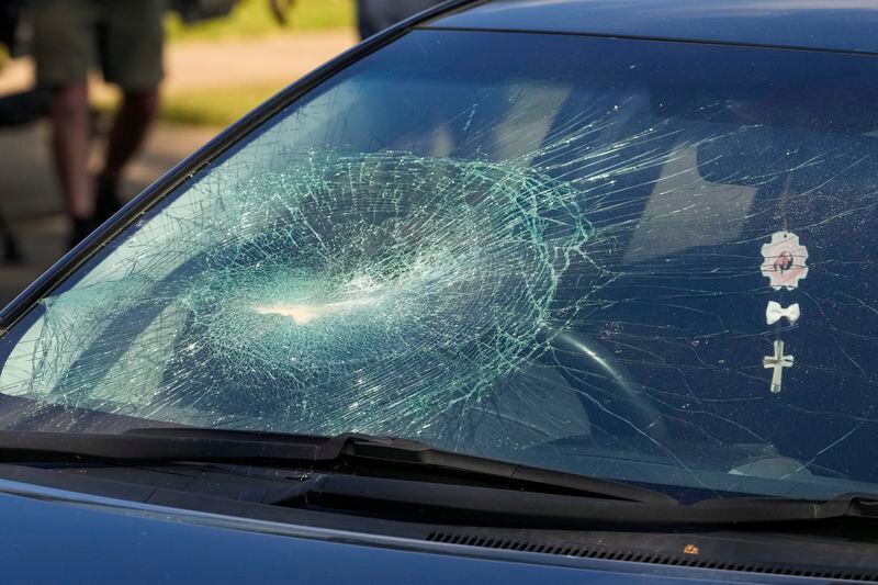 A car with its windscreen smashed, is parked outside the Christ the Good Shepherd Church in suburban Wakely in western Sydney, Australia, Tuesday, April 16, 2024. Australian police say a knife attack in Sydney that wounded a bishop and a priest during a church service as horrified worshippers watched online and in person, and sparked a riot was an act of terrorism. (AP Photo/Mark Baker)