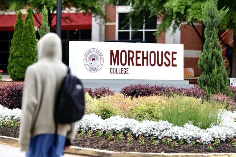 A student walks by a Morehouse College, where President Joe Biden is set to speak May 19 at the school's commencement ceremony. News that Biden was coming to Morehouse spurred protests by students and faculty over his handling of the Israel-Hamas war. (Miguel Martinez/AJC)