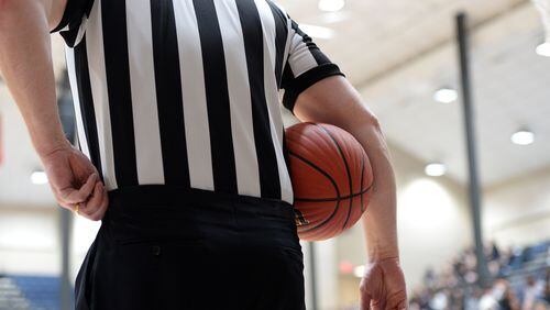 MARCH 4, 2017  MARIETTA A referee is shown during a timeout as the St Francis Knights play the Greenforest Eagles in the state semi-finals of the high school basketball playoffs at the Cobb County Civic Center Saturday, March 4, 2017. 
The winner will advance to the state championships next week at either Georgia Tech or UGA. Kent D. Johnson/AJC