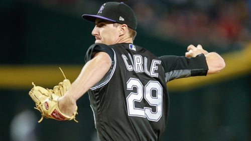 PHOENIX, AZ - SEPTEMBER 14: Colorado Rockies relief pitcher Shane Carle (29) throws a pitch during the MLB baseball game between the Colorado Rockies and the Arizona Diamondbacks on September 14, 2017 at Chase Field in Phoenix, Arizona. (Photo by Kevin Abele/Icon Sportswire) (Icon Sportswire via AP Images)