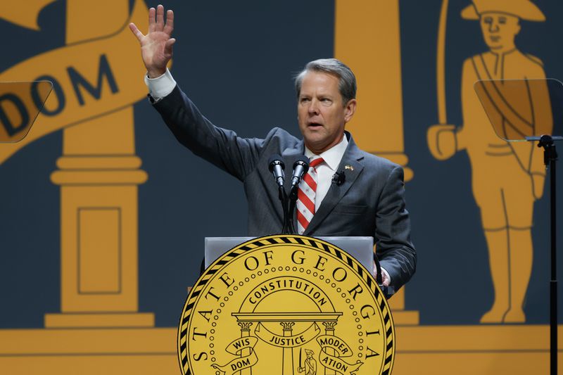 Gov. Brian Kemp waves to the hundreds of people who turned out for his inaugural address Thursday at Georgia State University's Convocation Center. (Natrice Miller/natrice.miller@ajc.com) 