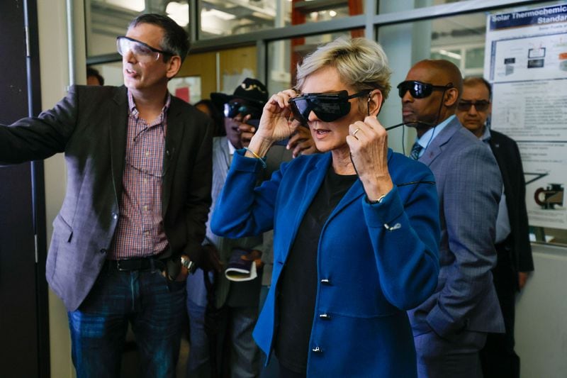 Energy Secretary Jennifer M. Granholm wears safety glasses as she prepares to see a simulated solar room during a Strategic Energy Institute labs tour at Georgia Tech on Thursday, April 4, 2024. Granholm's other Atlanta stops included the Russell Innovation Center for Entrepreneurs and Morehouse College. (Miguel Martinez /miguel.martinezjimenez@ajc.com)
