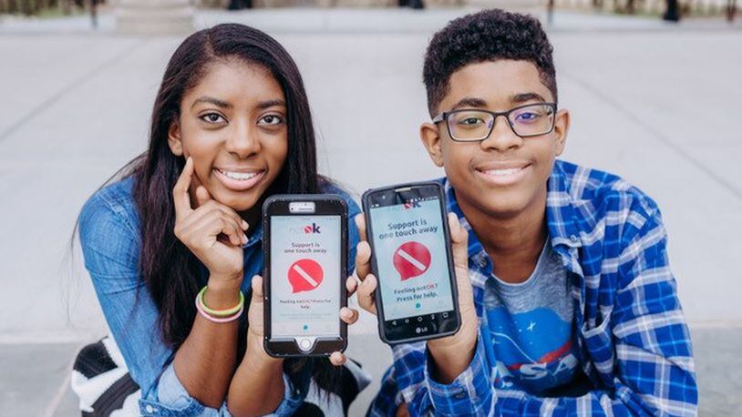 Hannah and Charlie Lucas of Cumming created the notOK app, a digital panic button that can summon a designated list of people when you’re in distress. CONTRIBUTED BY VANIA STOYANOVA