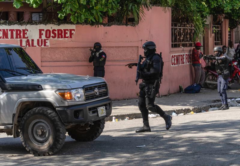 Police stop at a car to inspect in Port-au-Prince, Haiti, Monday, April 22, 2024. Haiti's health system has long been fragile, but it's now nearing total collapse after gangs launched coordinated attacks on Feb. 29, targeting critical state infrastructure in the capital and beyond. (AP Photo/Ramon Espinosa)