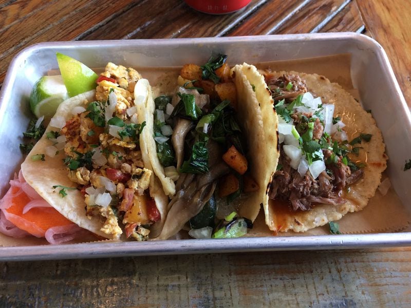 The tacos at Muchacho are served on made-in-house tortillas. Shown here are the breakfast taco with egg and chorizo; the rajas (poblano strips with other veggies); and the barbacoa. CONTRIBUTED BY WENDELL BROCK