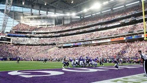 Fans cheer in U.S. Bank Stadium during the first half of an NFL football game between the Minnesota Vikings and the Los Angeles Rams, Sunday, Nov. 19, 2017, in Minneapolis. (AP Photo/Bruce Kluckhohn)