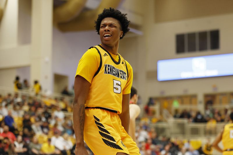 Kennesaw State forward  Brandon Stroud (5) reacts after scoring during the second half against Liberty Flames at the Kennesaw State Convention Center on Thursday, Feb 16, 2023. Miguel Martinez / miguel.martinezjimenez@ajc.com