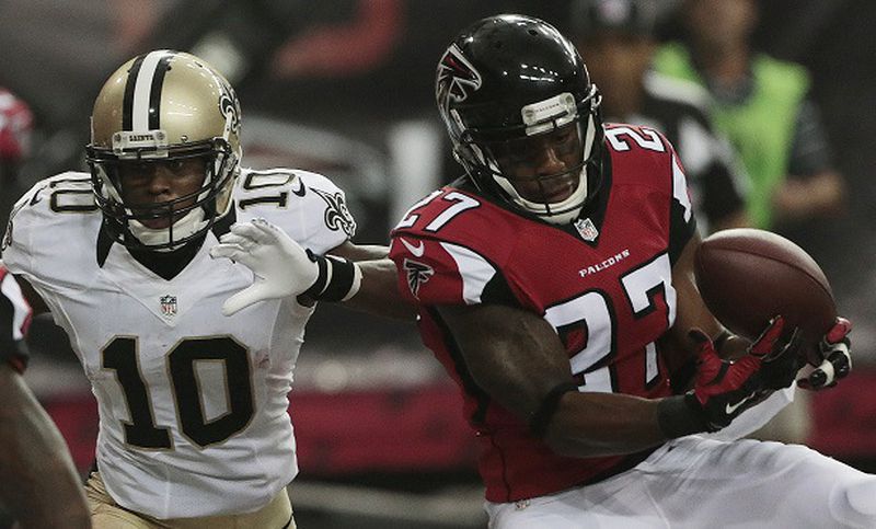 Atlanta Falcons cornerback Robert McClain (27) makes a catch for an interception as the intended receiver New Orleans Saints wide receiver Brandin Cooks (10) looks on during the second half of an NFL football game, Sunday, Sept. 7, 2014, in Atlanta. (AP Photo/John Bazemore) Somebody's going to win this division. Just not anybody any good. (Curtis Compton/AJC photo)