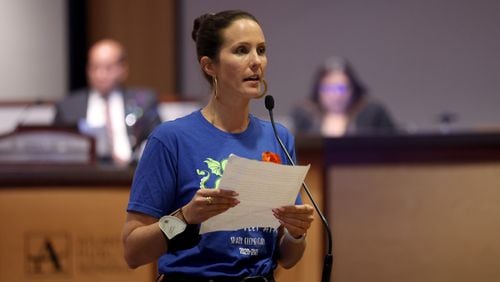 Unlike other speakers, Springdale Park Elementary School parent Shannon Gaggero turns around to address the audience as she speaks to the Atlanta Board of Education during the public comments portion at the Atlanta Public Schools building Monday, Aug. 8, 2022, in Atlanta. With a new school, Springdale Park Elementary School will see the biggest change because of the rezoning. (Jason Getz / Jason.Getz@ajc.com)