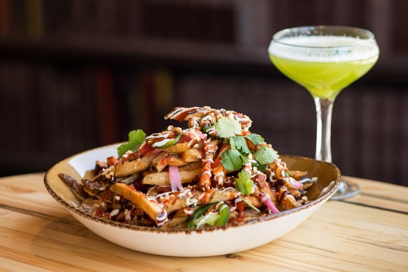 If you try just one thing at Punch Bowl Social, go for the Sriracha Peanut Fries. CONTRIBUTED BY MIA YAKEL