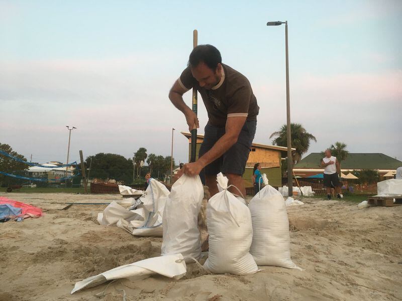 Adam Demico was among the residents of Tybee Island hurriedly stuffing sandbags ahead of Hurricane Irma. 