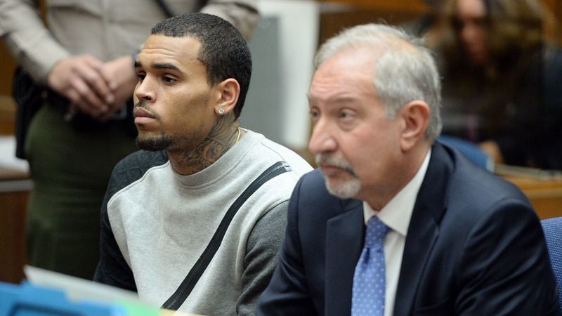 Singer Chris Brown and attorney Mark Geragos attend a progress hearing at Los Angeles Superior Court on October 23, 2014.  Brown was first placed on probation after the 2009 domestic violence case in which he plead guilty to assaulting his then-girlfriend, Rihanna.