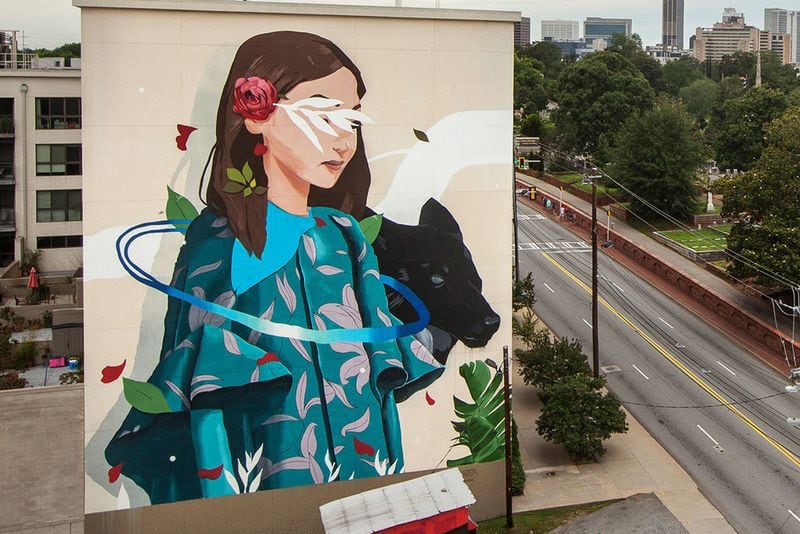 One of the tallest murals in recent years was painted by Spanish artist Sabek, as part of the OuterSpace Project. It covers the side of a six-story building at 573 Memorial Drive. CONTRIBUTED: GREG MIKE